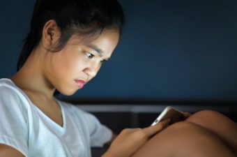 girl looking at cell phone