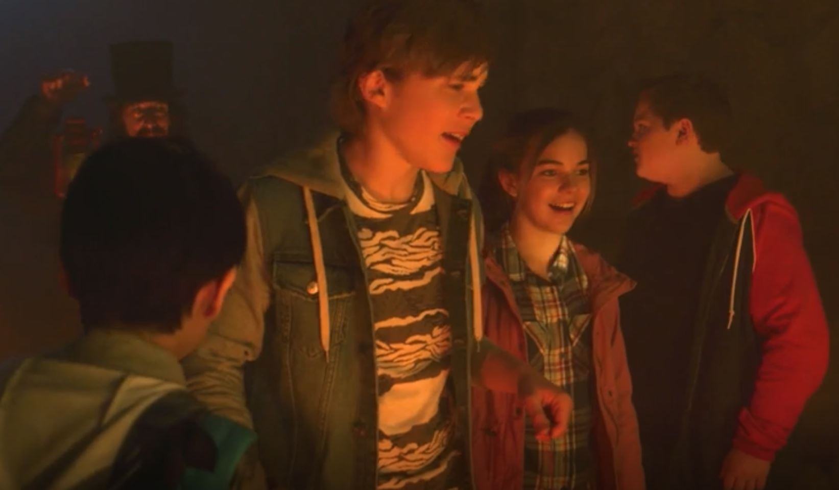 Four kids in dark cave