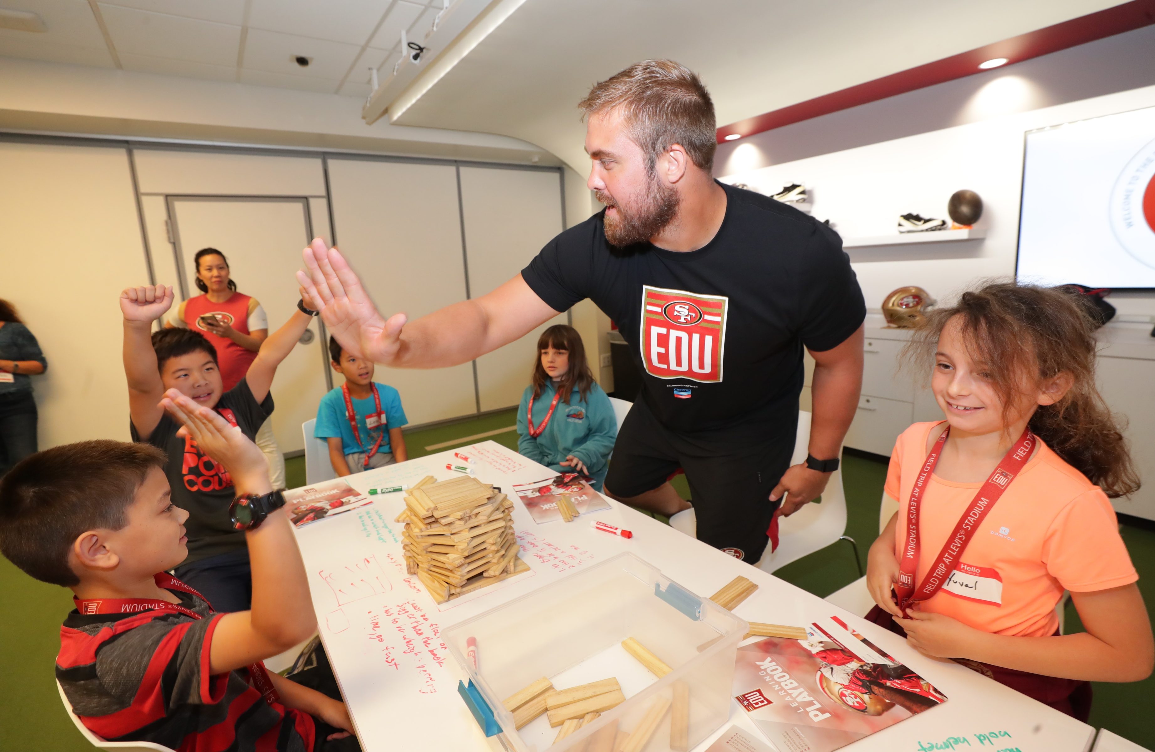 Former 49ers player Ben Garland with students.