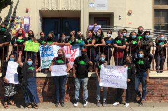 OEA President Keith Brown and educators in front of Melrose Leadership Academy, calling for safe, fully staffed, and adequately funded schools.