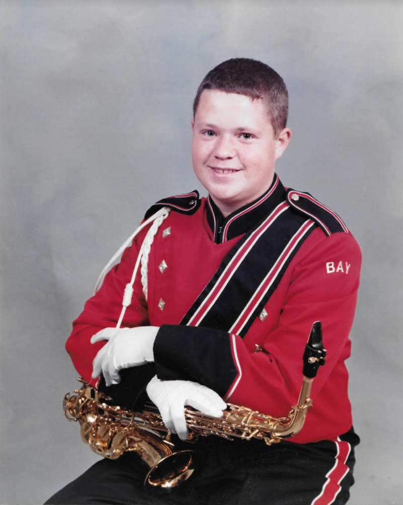 A 1997 marching band photo of Jennifer Yoo‑Brannon’s husband.