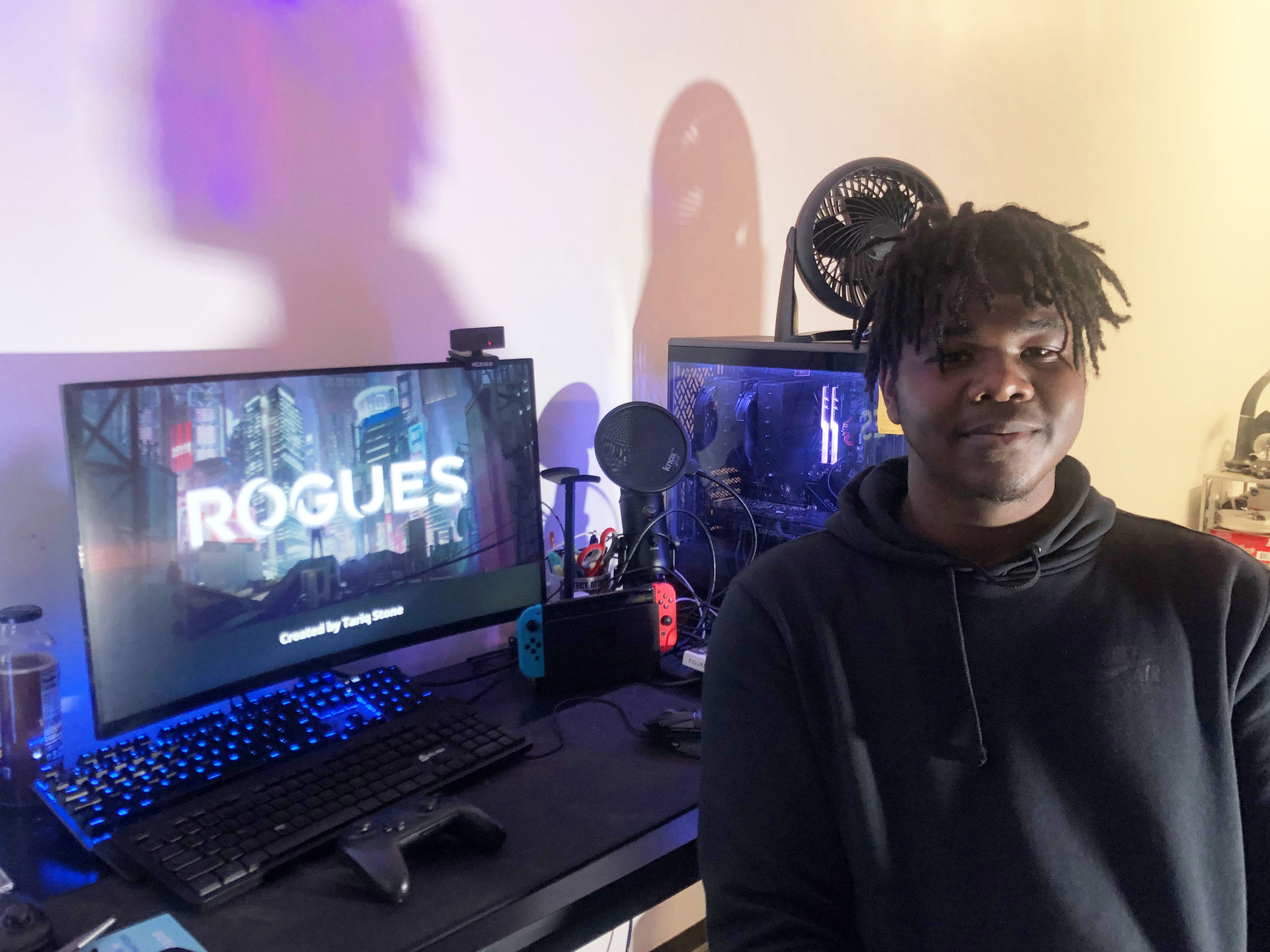 Student Tariq Stone with computer and film equipment