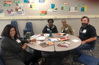 group of teachers sitting at a round table