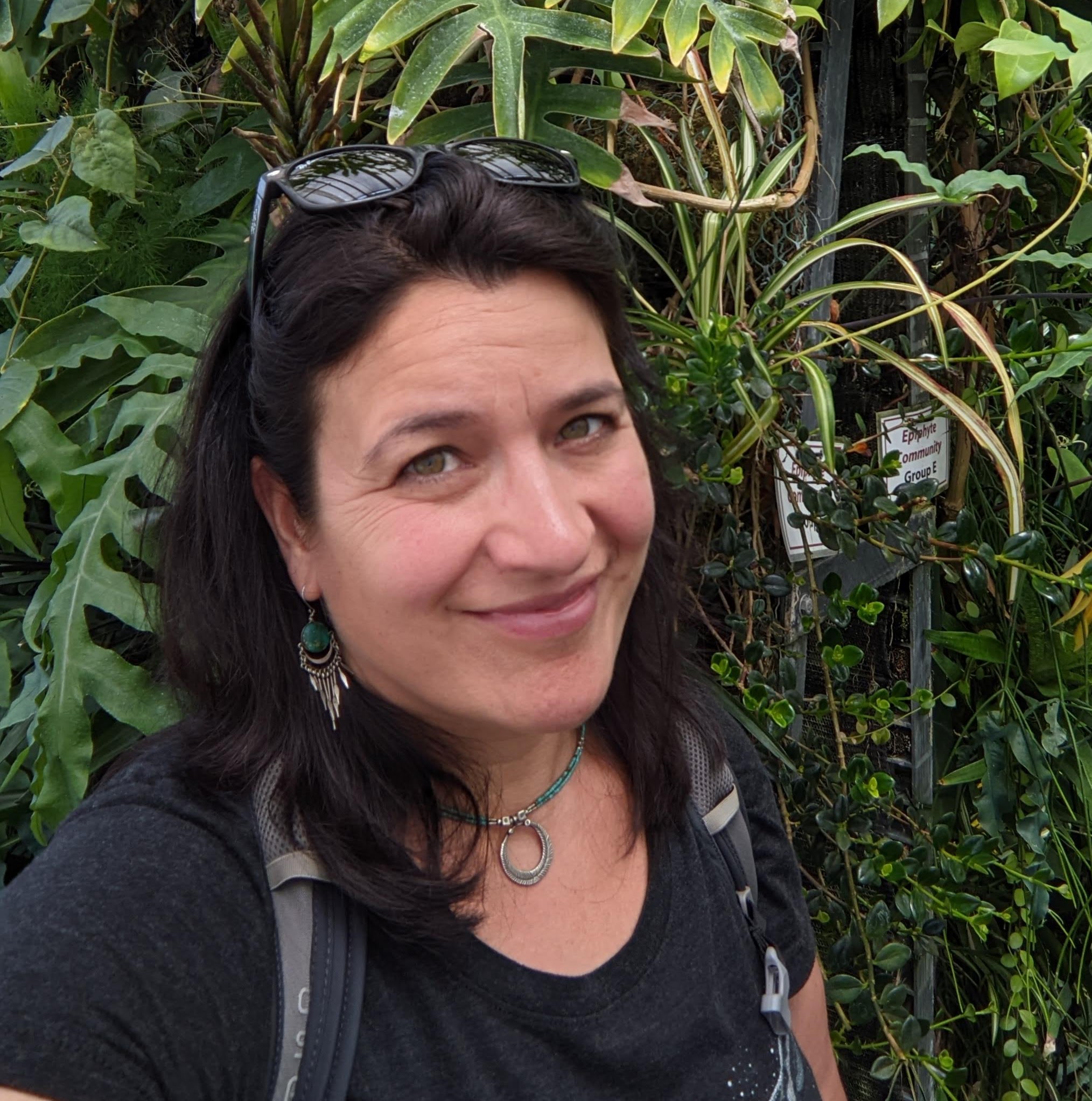 picture of a woman standing in the forest
