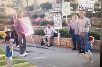 Hartnell - Group of people holding signs