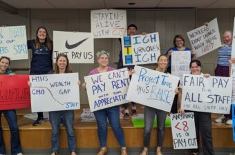 High Tech Education Collective holding signs for first contract