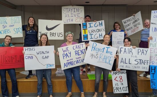 High Tech Education Collective holding signs for first contract