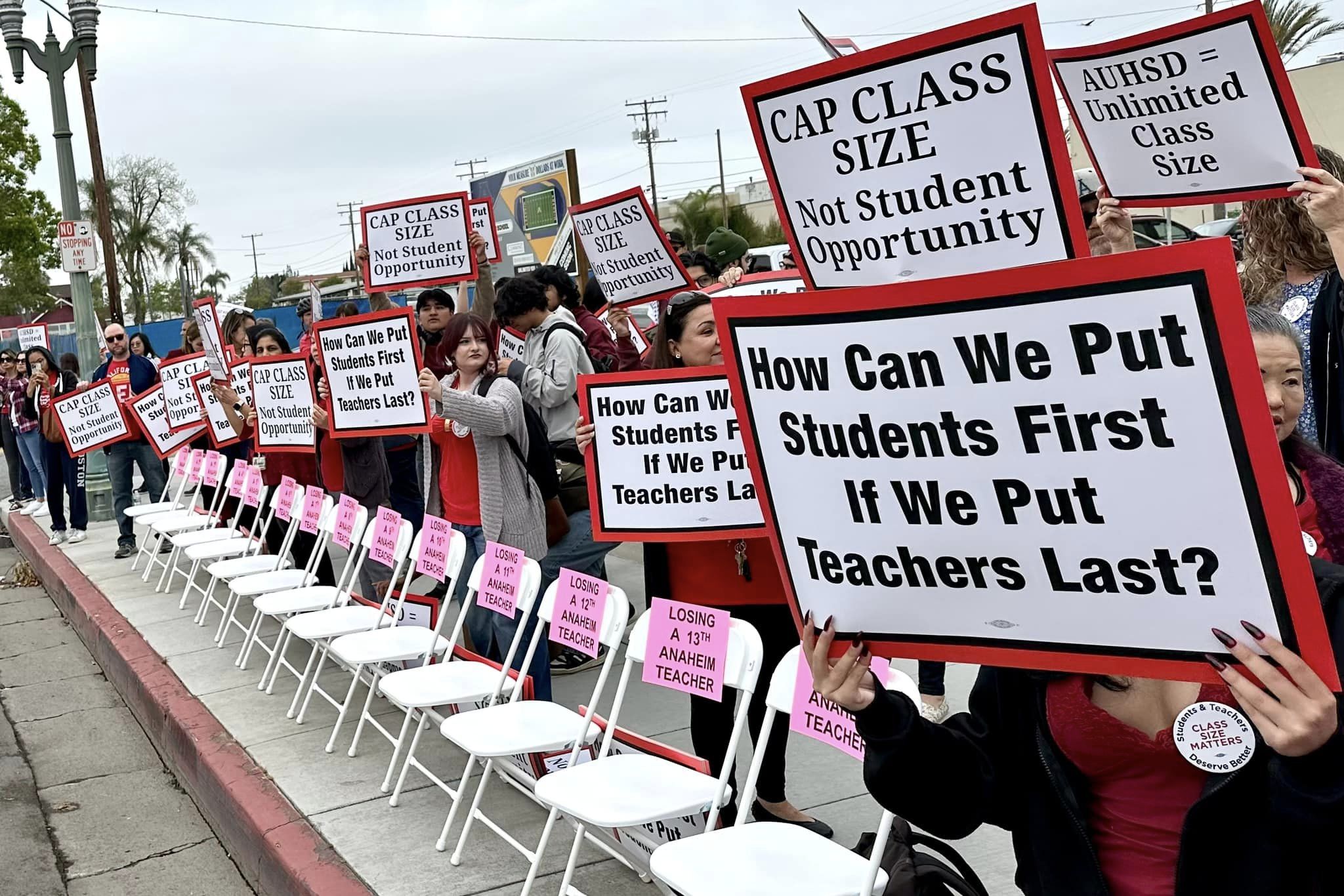 ASTA members set up empty chairs to show the impact of losing educators.