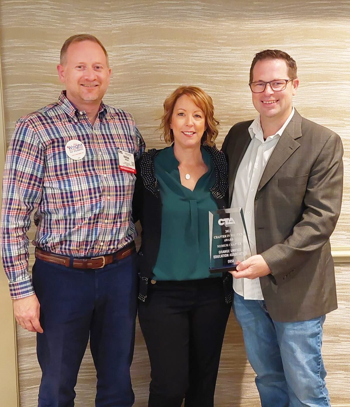 Orange Unified EA member and State Council Representative Nate Dawson, OUEA Vice President Karin Barone and OUEA President