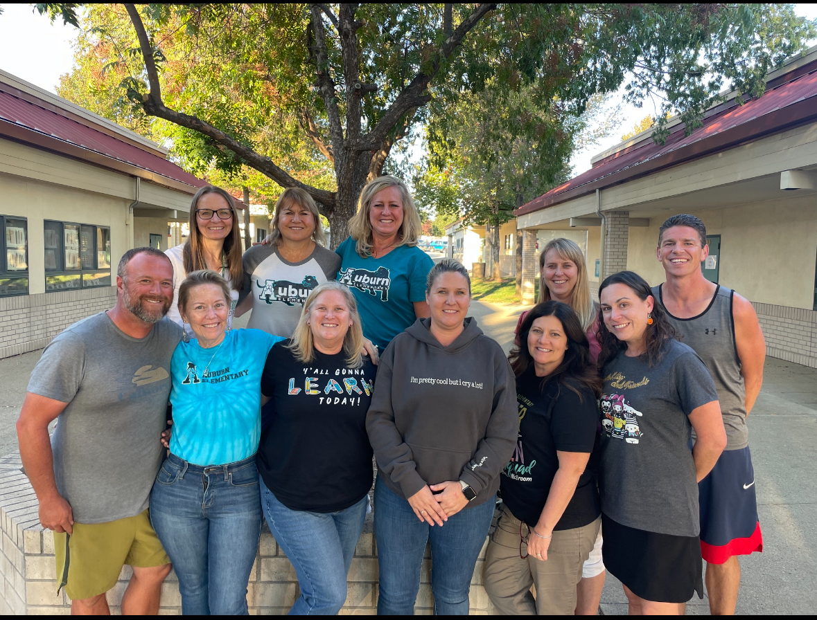 Led by president Sara Liebert (front row, third from left), Auburn educators fought the district to get safe drinking water for students