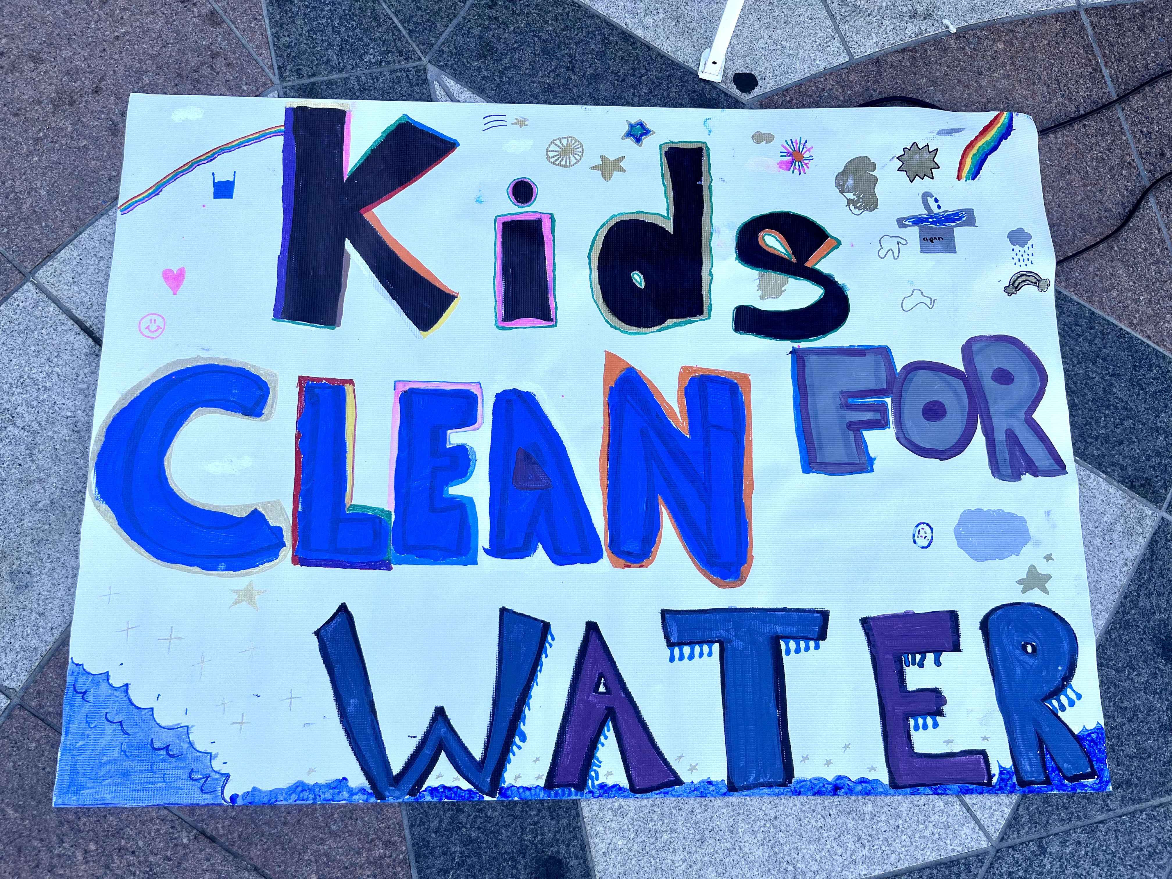 Oakland student's clean water sign advocating for safer schools