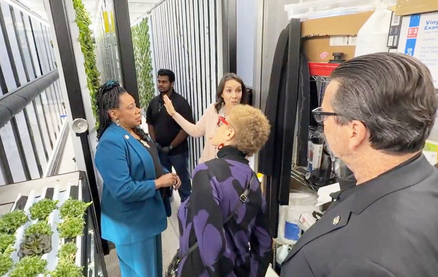 Pringle and others at Magnolia High School’sAgriscience Community Center (MACC) where MACC Farm Coordinator and ASTA Member Sabina Giakoumis explains that the walls are used to nurture and grow plants.
