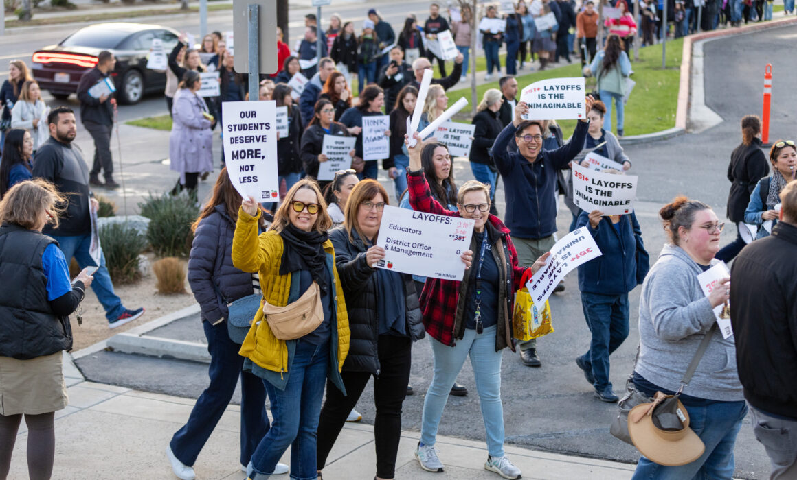 SAEA members protest the proposed layoffs.