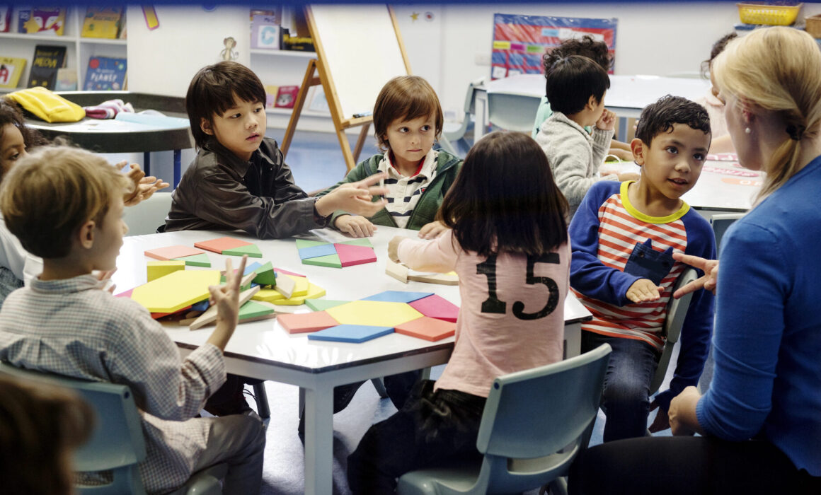 Stock photo of a teacher with elementary students
