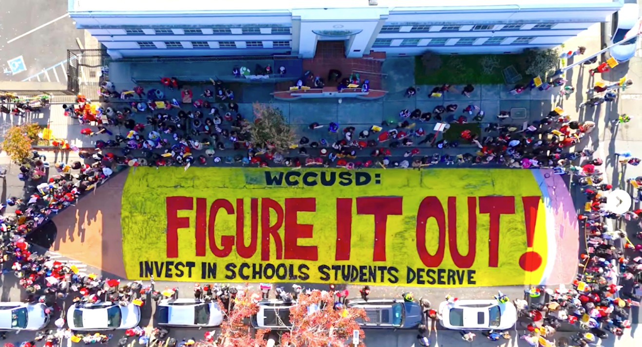 On the last day of the UTR strike, educators and community painted a 100-foot street muralin front of district offices. Photo: Courtesy @dpl19 Dennis Ivan Perez Bravo.