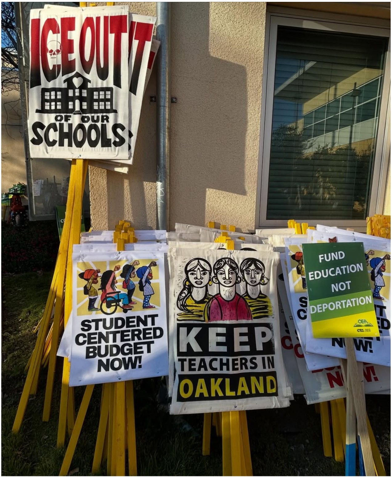 Photo of Oakland Education Association picket signs