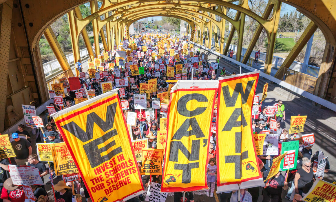 Striking Twin Rivers and Natomas educators march across the landmark Tower Bridge in Sacramento. Credit: @movementphotographer