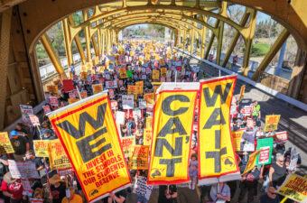 Striking Twin Rivers and Natomas educators march across the landmark Tower Bridge in Sacramento. Credit: @movementphotographer