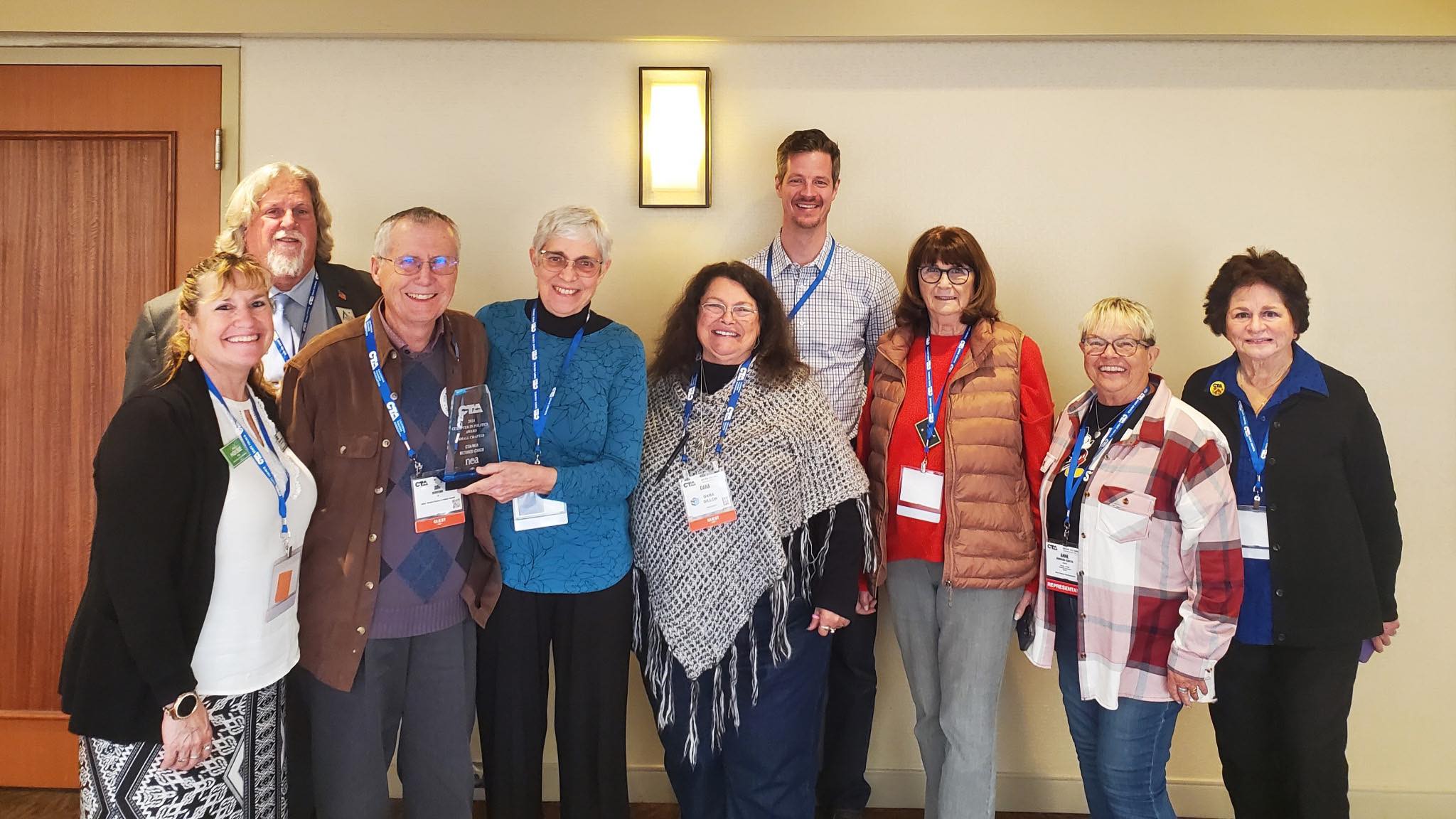 Deborah Burfeind, fourth from left and flanked by herhusband Jim Burfeind and CTA/NEA-Retired President Dana Dillon, accepted the CTA Chapter in Politics Award on behalf of her chapter in 2025.