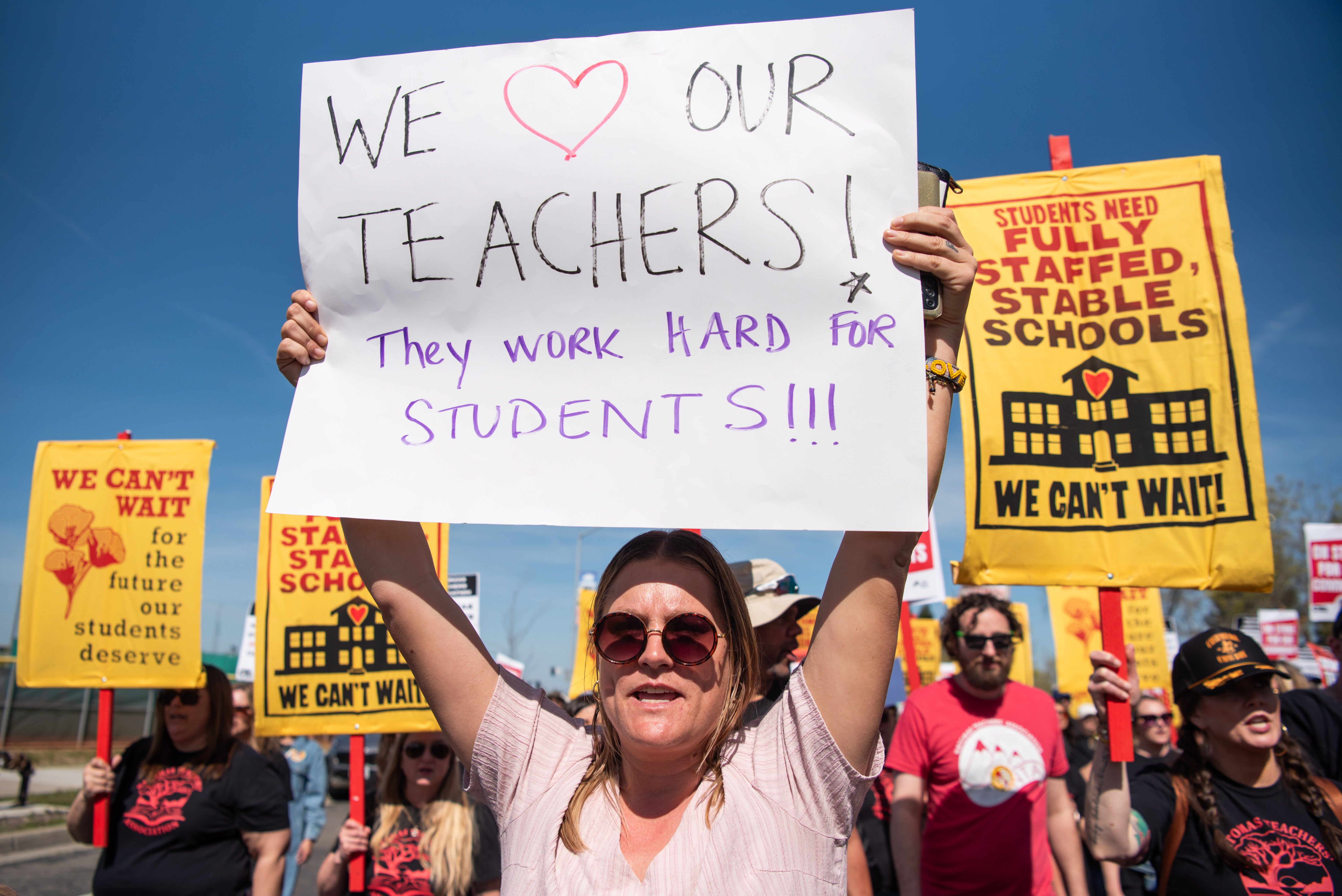 Natomas teacher holding We love our teachers sign