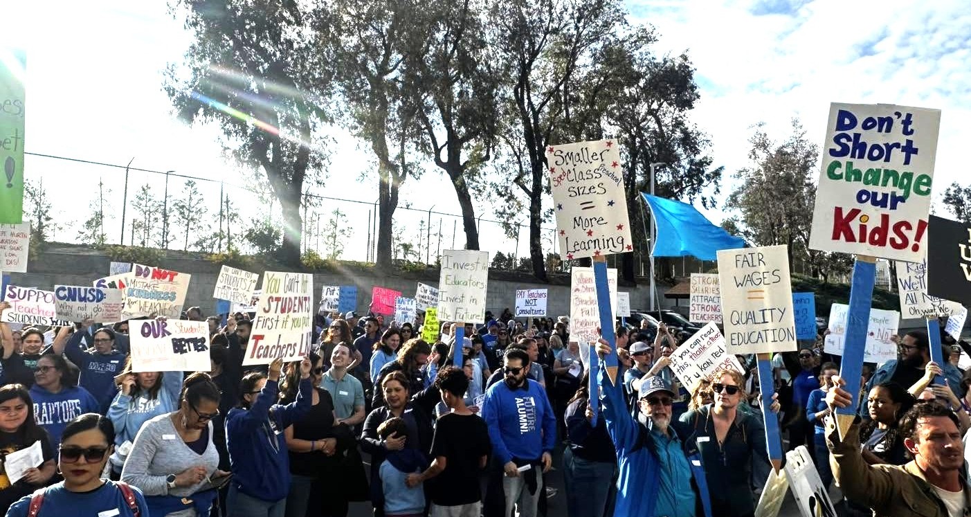 CNTA members outside of a school board meeting in May.