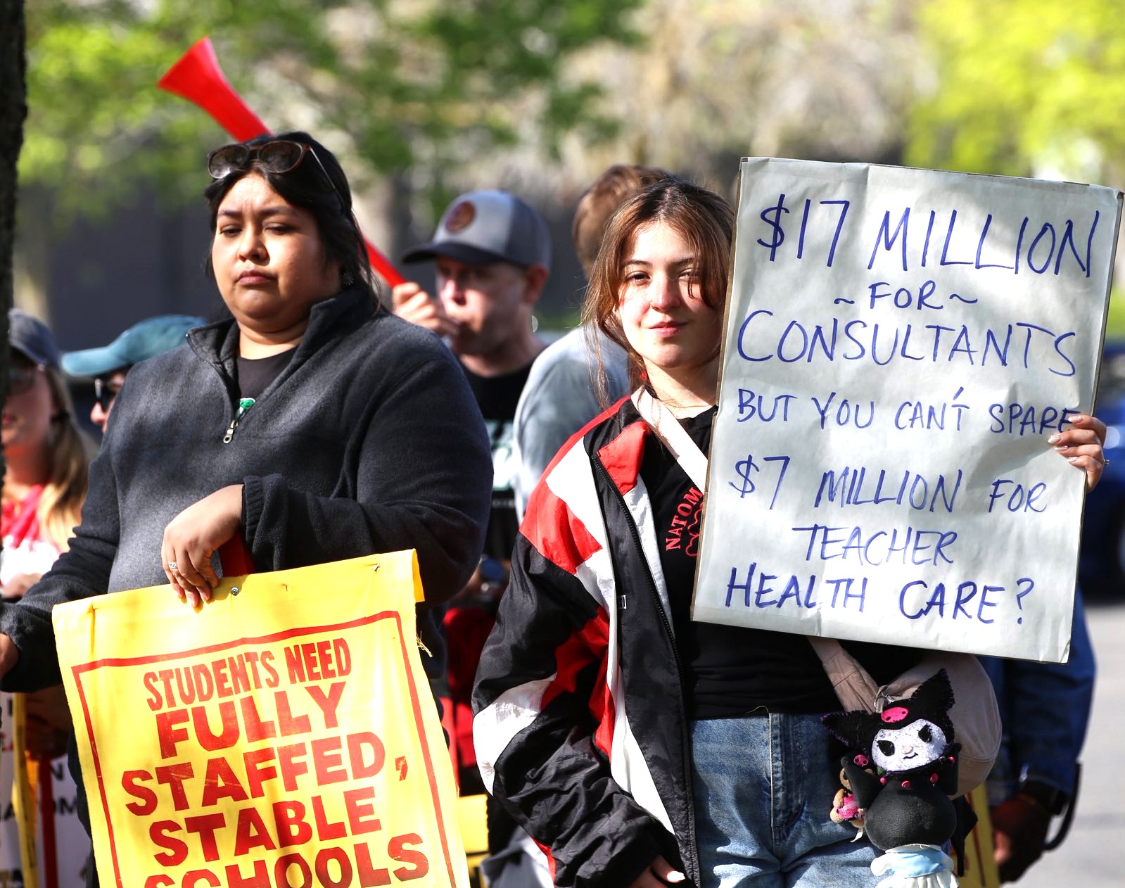 Striking Natomas Teachers Assn. members, below, and Twin Rivers United Educators members, at right, demand fairness — and paid health care.