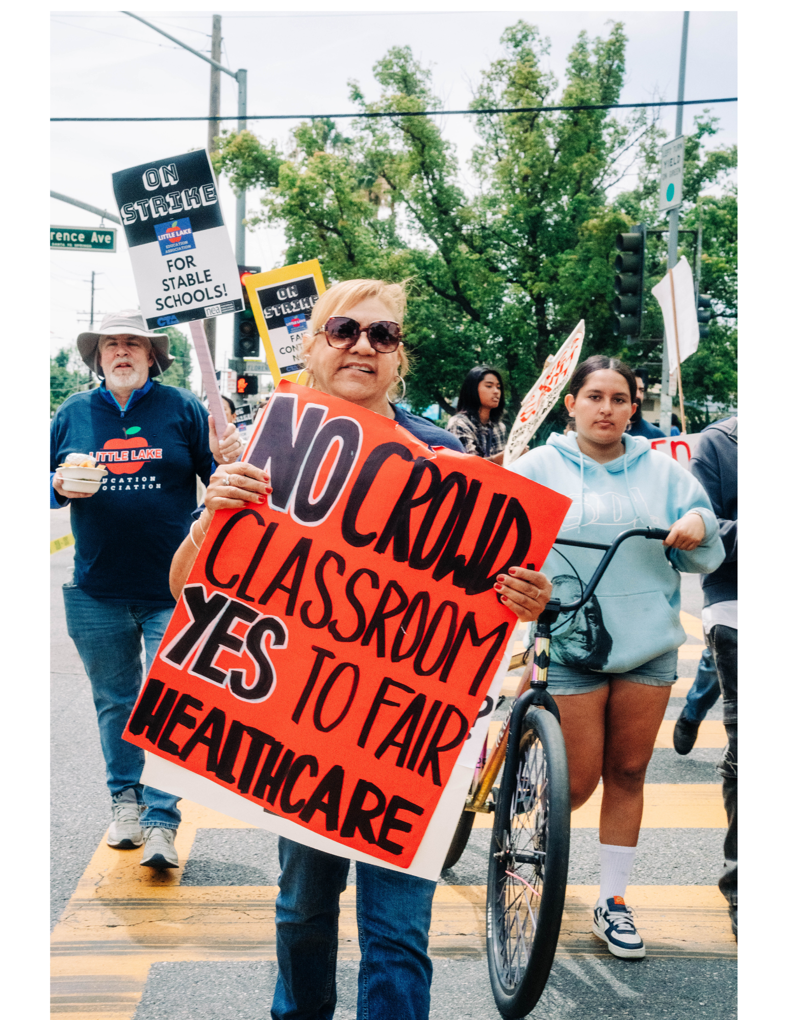 LLEA members, as well as parents and community, called for improved health care benefits.