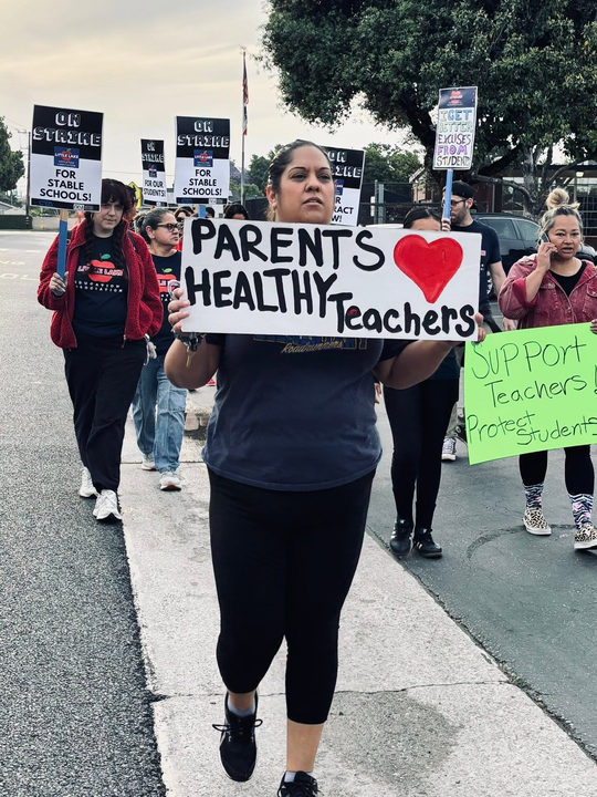 LLEA members, as well as parents and community, called for improved health care benefits.