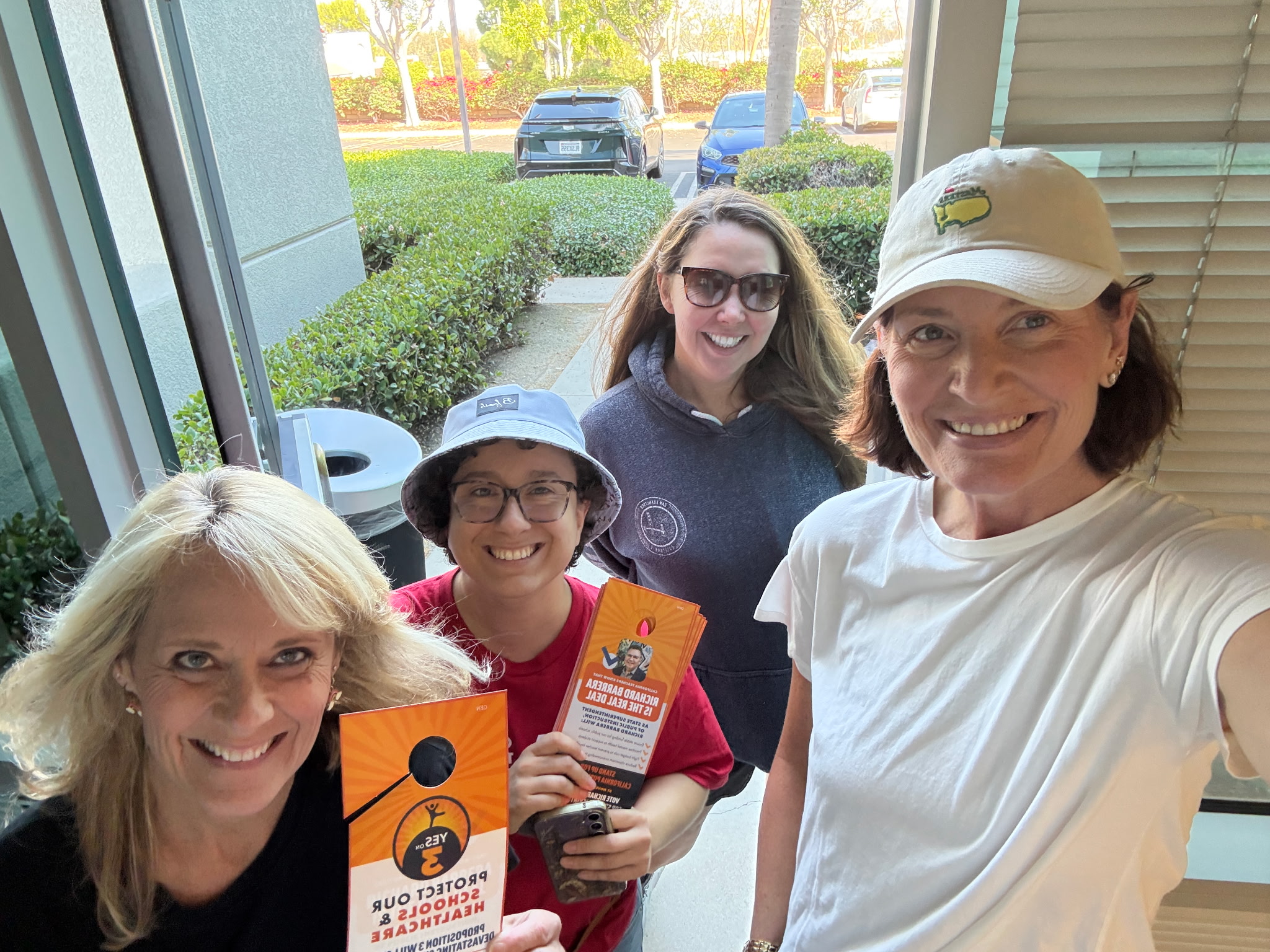 Saddleback Valley Educators Assn. President Mandy DeGroote, right, withfellow union members knocking on doors in September.